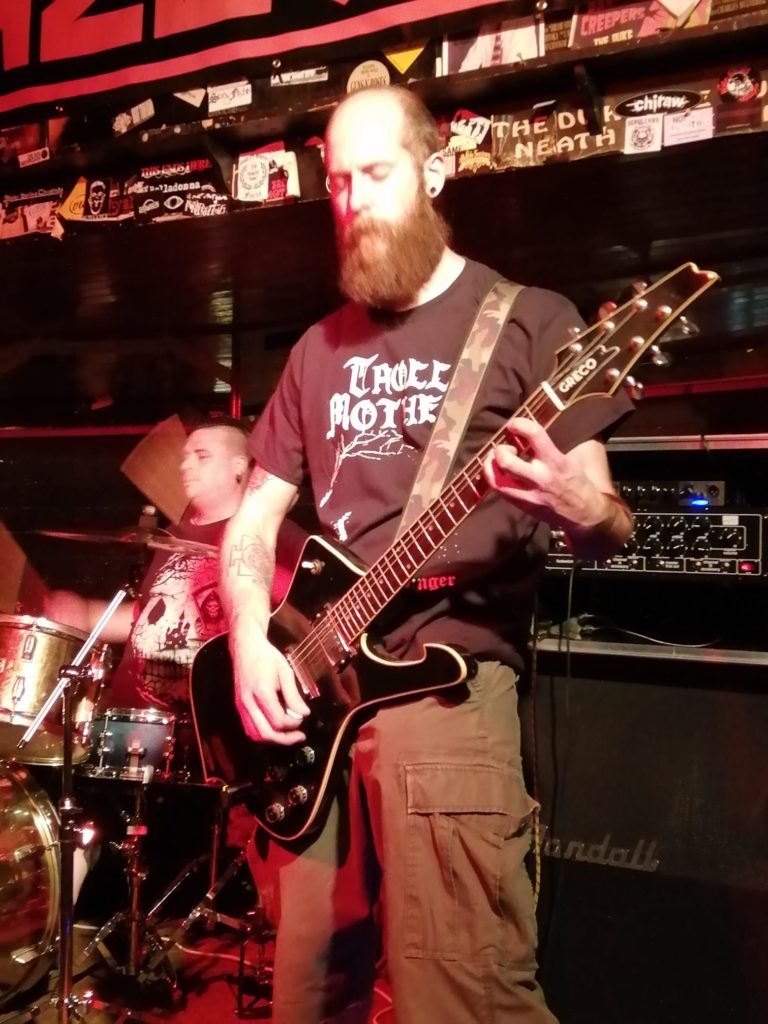 The Guitarmourer, complete with uncontrolable beard, playing a 1978 Greco Mirage at a gig in South Wales, UK, in 2018.